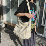 Sac messager en toile de couleur unie