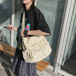 Sac messager en toile de couleur unie